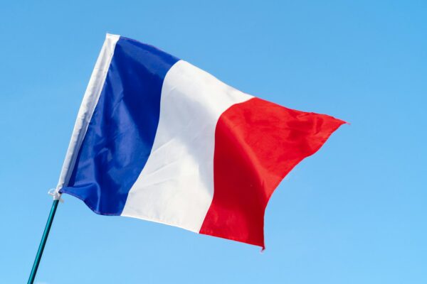 Flag of France waving in the wind in the sky