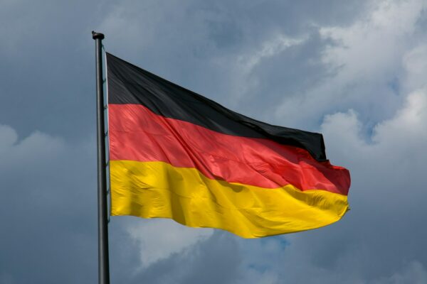 German flag in front of dark clouds